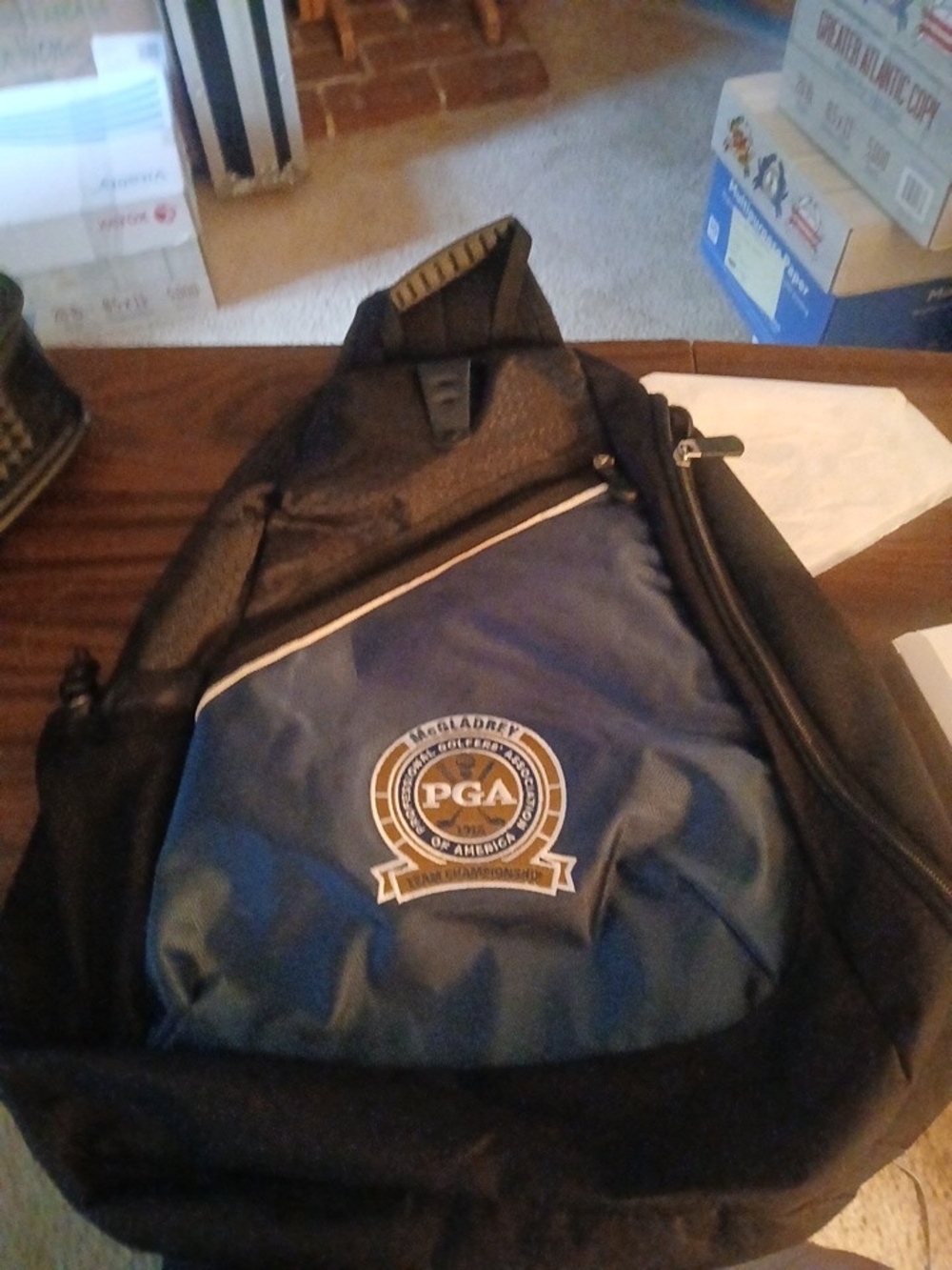 PGA Tour Black and Navy Blue Sling Backpack with PGA Logo